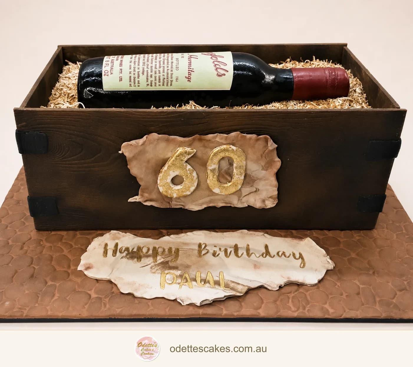 60th birthday cake sculpted as a timber wine box with a bottle and personalised plaque