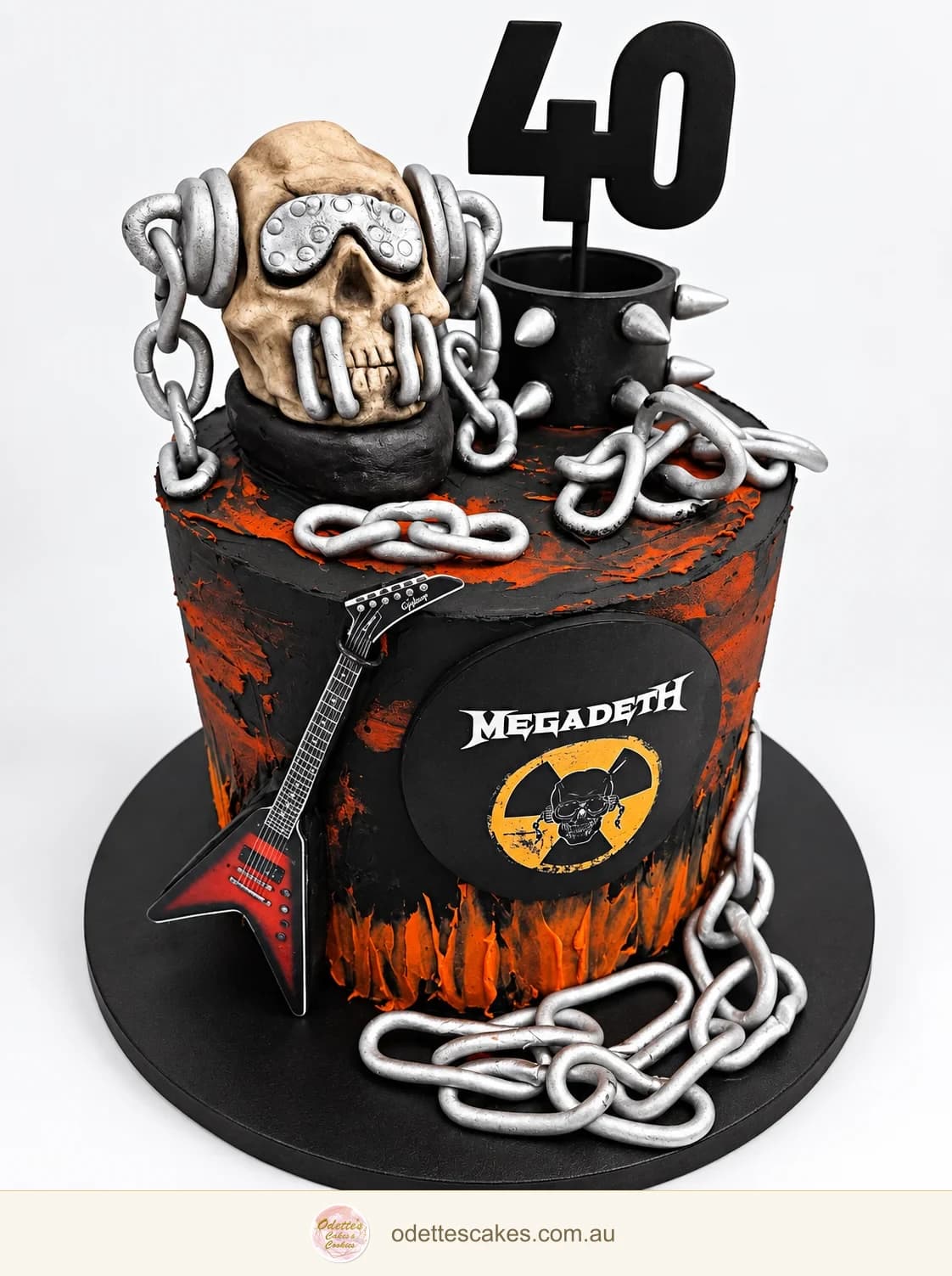 Black and orange 40th birthday cake with a skull, silver chains, guitar and Megadeth design, handmade in Jindalee, Perth