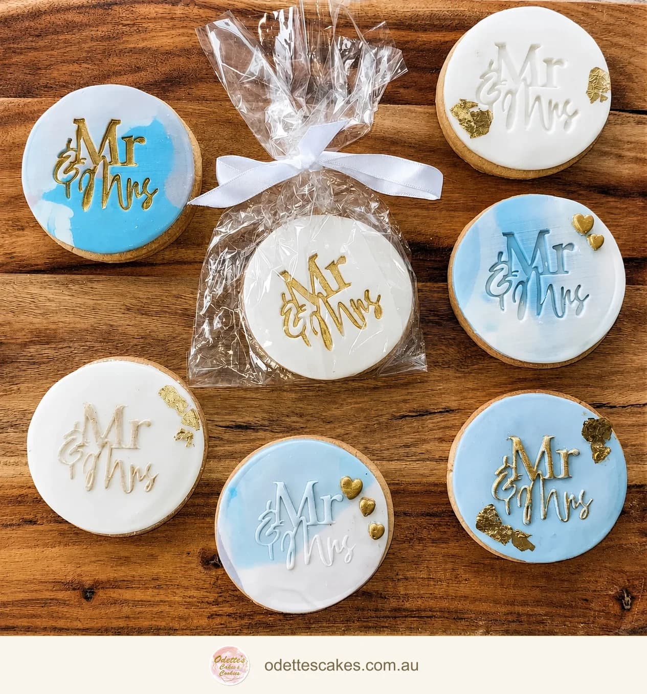 Round blue and white wedding favour cookies with gold and white Mr and Mrs lettering
