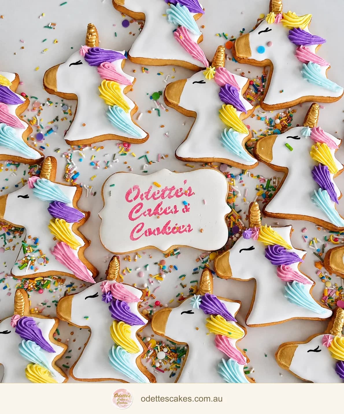 Unicorn-shaped cookies with gold horns and pastel pink, lilac, yellow and blue icing manes